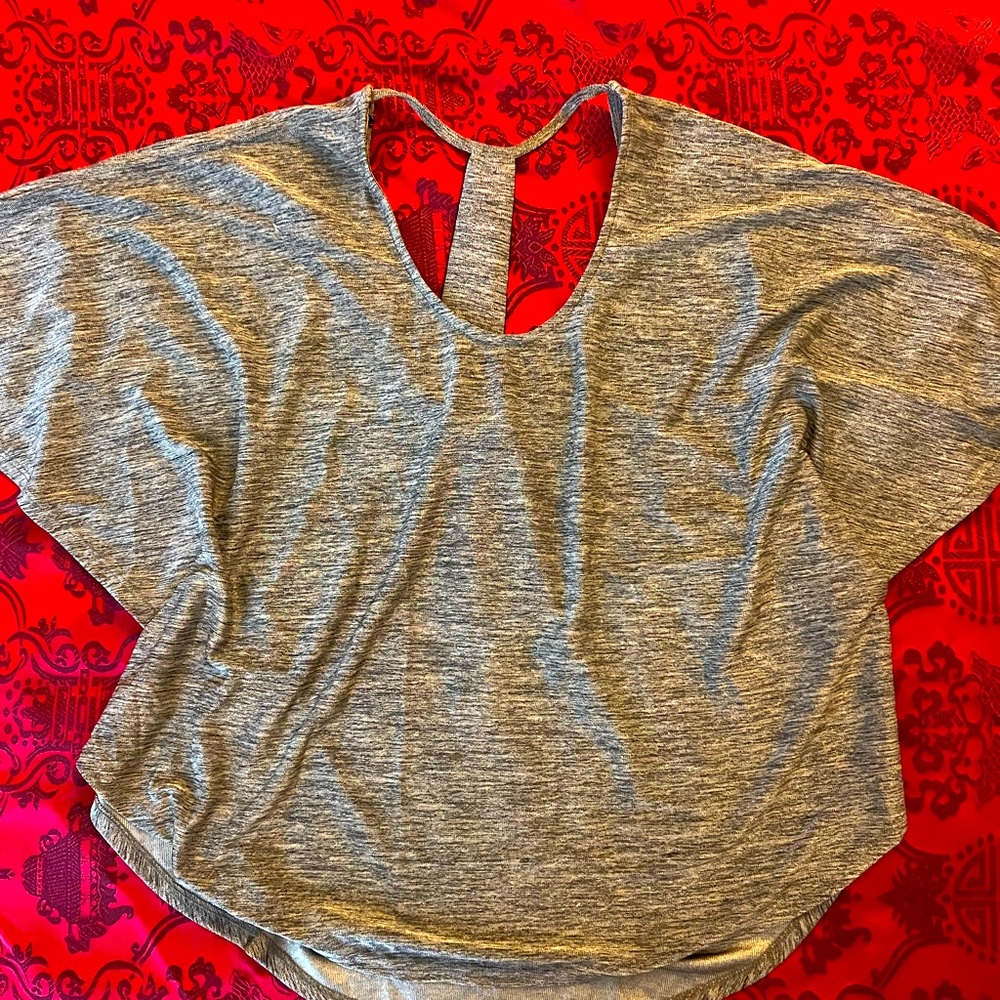 Bebe metallic top size XS. Like-new condition.